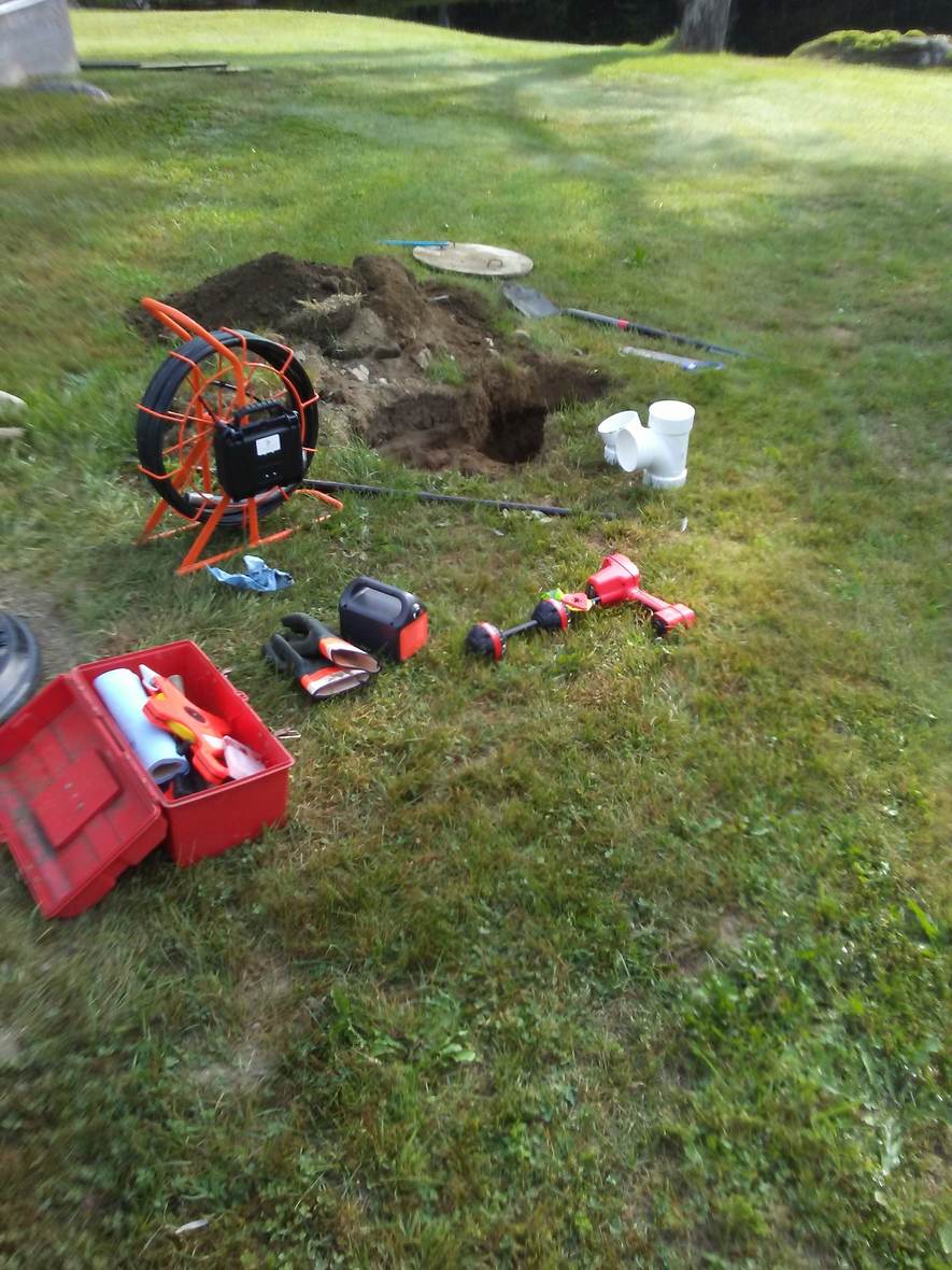 Camera and locating gear staged on site — Great North Woods Septic Design field photo