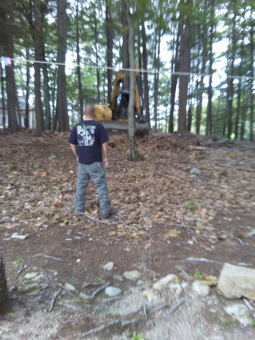 Checking grade along the shoreline — Great North Woods Septic Design field photo